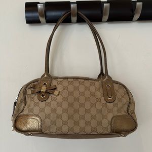 Gucci tan/copper color baguette shape shoulder purse
